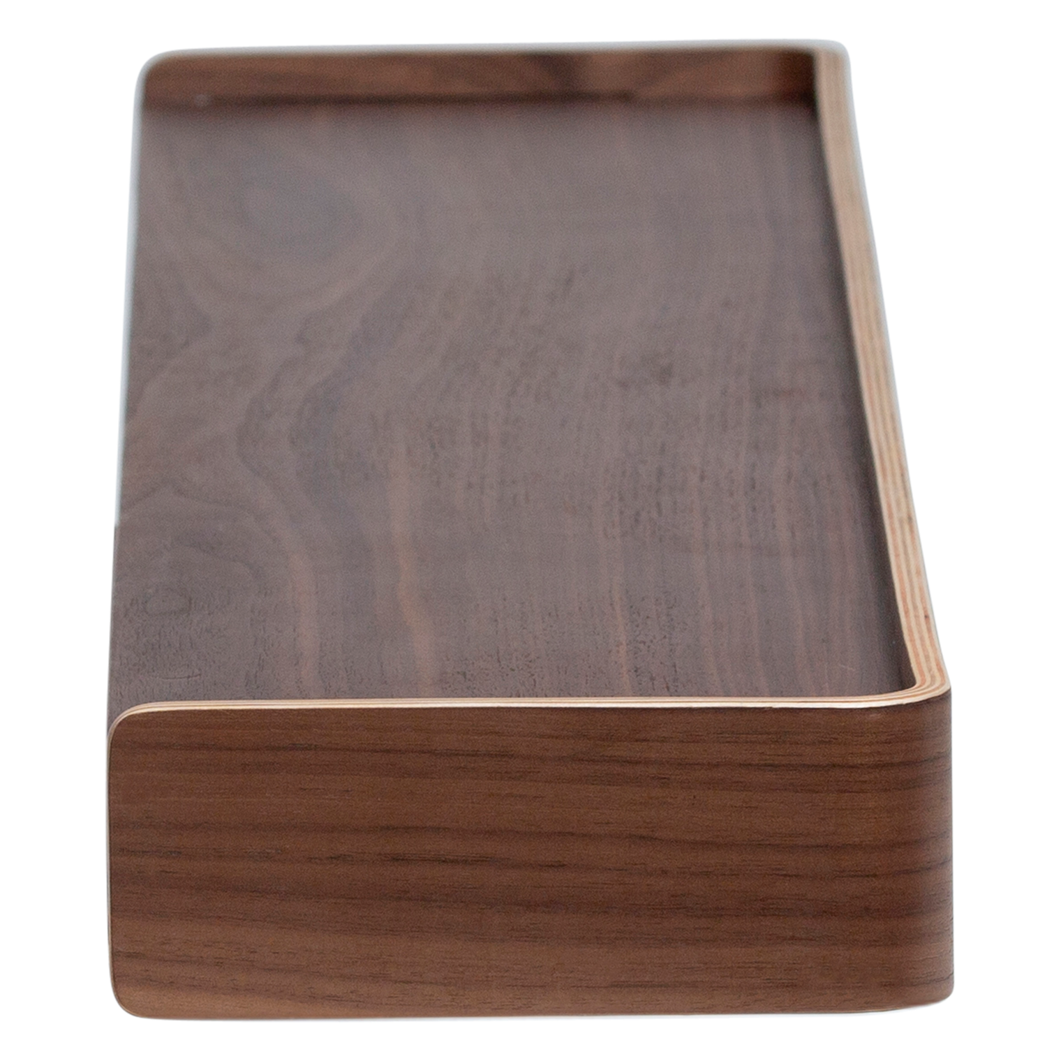 Protopia wall shelf in walnut veneer with a slim profile and curved ends, ideal for displaying artwork, books, photographs, and decorative accessories.