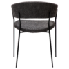 reboot-armchair-raven-black-back Reboot armchair upholstered in Raven Black fabric with a modern curved silhouette and upholstered frame.