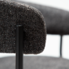 reboot-armchair-raven-black-handle Reboot armchair upholstered in Raven Black fabric with a modern curved silhouette and upholstered frame.