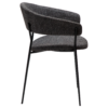 reboot-armchair-raven-black-side Reboot armchair upholstered in Raven Black fabric with a modern curved silhouette and upholstered frame.