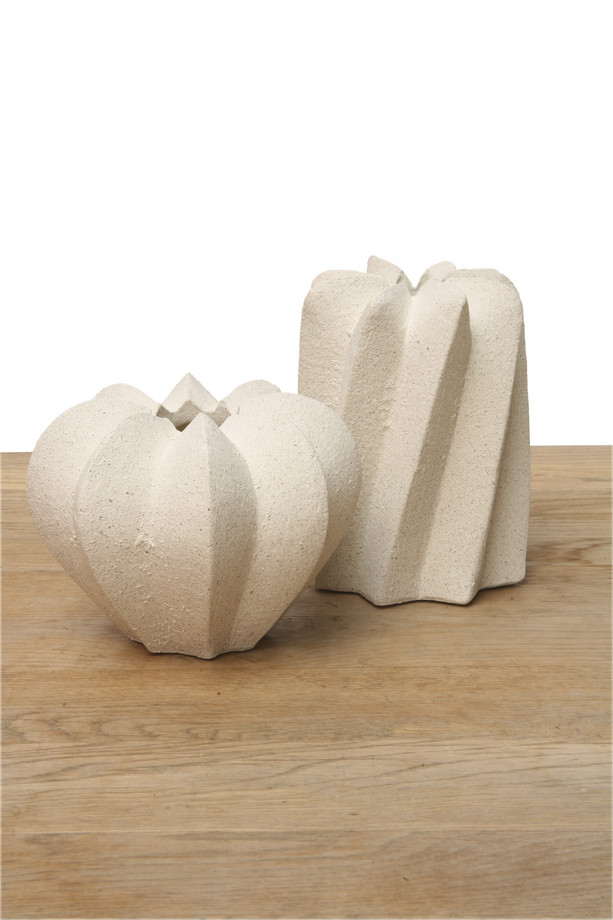 Sculptura white ceramic vase with folded sculptural detailing and textured finish, ideal for modern shelves, consoles, and decorative styling.