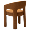 Splendor armchair upholstered in Pumpkin Spice fabric with a fully upholstered frame and sculptural curved design.