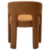 Splendor armchair upholstered in Pumpkin Spice fabric with a fully upholstered frame and sculptural curved design.
