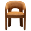 Splendor armchair upholstered in Pumpkin Spice fabric with a fully upholstered frame and sculptural curved design.
