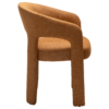 Splendor armchair upholstered in Pumpkin Spice fabric with a fully upholstered frame and sculptural curved design.