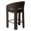 Splendor counter stool upholstered in major brown bouclé fabric with a curved backrest, padded seat and integrated black footrest, ideal for kitchen islands and breakfast bars.
