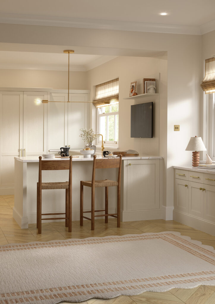 Taupe shaker kitchen with breakfast bar seating, stone worktops and brass accents.
