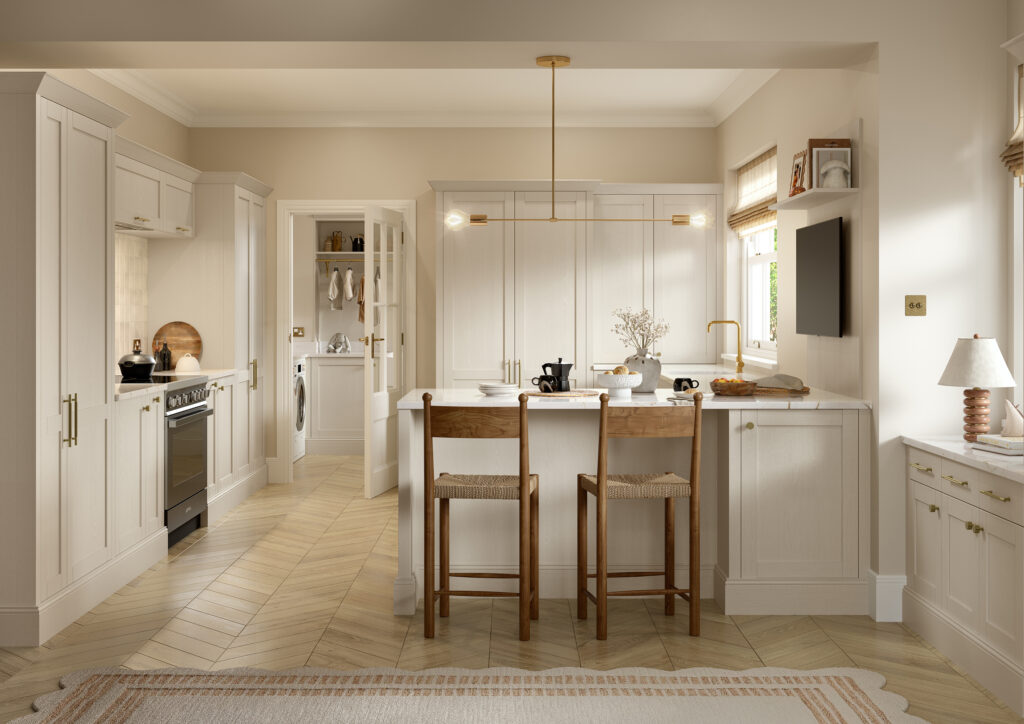 Taupe shaker kitchen with island seating, brass handles and integrated utility room.