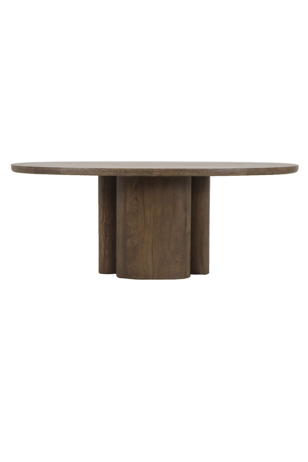 Walnut oak oval dining table with a warm wood finish, rounded tabletop, and sculptural pedestal base on a white background.
