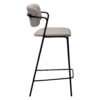 ZED counter stool upholstered in Cashmere bouclé fabric with slim black metal legs and integrated armrests, designed for modern kitchen islands and breakfast bars.