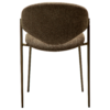 ZONE dining chair upholstered in dark olive bouclé fabric with antique pewter metal legs, featuring a sculptural Scandinavian design and curved backrest.