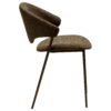 ZONE dining chair upholstered in dark olive bouclé fabric with antique pewter metal legs, featuring a sculptural Scandinavian design and curved backrest.