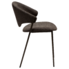 zone-dining-chair-major-brown-boucle-antique-brass-legs-side ZONE dining chair upholstered in Major Brown bouclé fabric with antique brass legs, featuring a curved Scandinavian-inspired backrest for modern dining spaces.