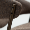 zone-dining-chair-major-brown-boucle-antique-brass-legs-zoom ZONE dining chair upholstered in Major Brown bouclé fabric with antique brass legs, featuring a curved Scandinavian-inspired backrest for modern dining spaces.