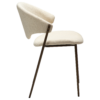 zone-dining-chair-simply-beige-boucle-antique-brass-legs-side ZONE dining chair upholstered in Simply Beige bouclé fabric with antique brass legs, featuring a curved Scandinavian-inspired backrest for modern dining spaces.