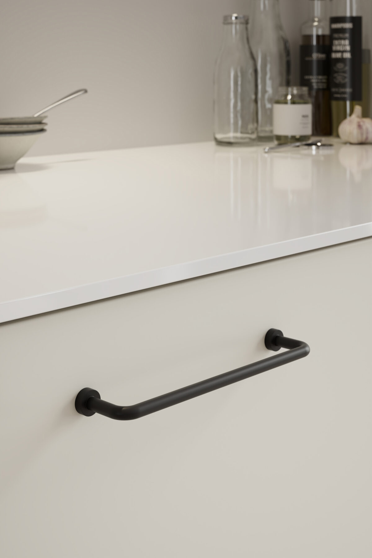 Lounge matt black Zamac cabinet handle with ergonomic concave grip for kitchen cabinets and bespoke furniture.