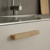 Elan FSC® 100% oak cabinet handle with a clear lacquered finish for kitchen cabinets, drawers, and bespoke furniture.