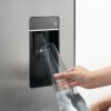 Fisher & Paykel 498L quad door refrigerator freezer with slim external water dispenser, automatic ice maker, and stainless steel finish.