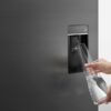 Fisher & Paykel 569L French door refrigerator freezer with slim water dispenser, automatic ice maker, and black steel finish.