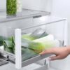Fisher & Paykel 80cm integrated French door refrigerator freezer with automatic ice maker, slim water dispenser, and panel-ready design.