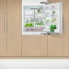 fisher-paykel-91cm-integrated-refrigerator-freezer-with-ice-unit-open Fisher & Paykel 91cm integrated refrigerator freezer with automatic ice maker, panel-ready design, and bottom freezer drawer for modern kitchens.