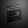 fisher-paykel-contemporary-oven-16-function-angle Fisher & Paykel contemporary oven with 16 cooking functions, touchscreen controls, and a sleek black glass finish.