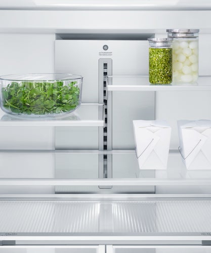 fisher-paykel-integrated-french-door-refrigerator-freezer-ice-water-contents Fisher & Paykel integrated French door refrigerator freezer with automatic ice maker, internal water dispenser, and panel-ready design for modern kitchens.