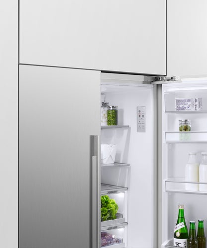 fisher-paykel-integrated-french-door-refrigerator-freezer-ice-water-half-open Fisher & Paykel integrated French door refrigerator freezer with automatic ice maker, internal water dispenser, and panel-ready design for modern kitchens.