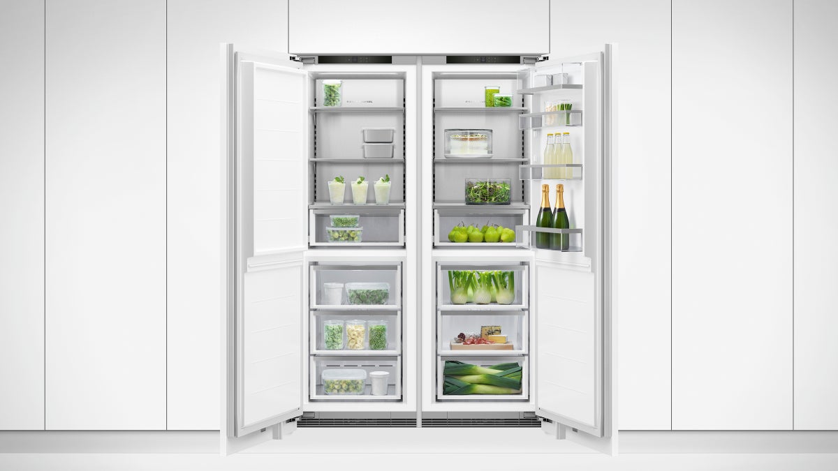fisher-paykel-integrated-refrigerator-freezer-ice-water-double Fisher & Paykel integrated refrigerator freezer with panel-ready design, internal water dispenser, automatic ice maker, and flexible food storage.