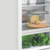 fisher-paykel-integrated-refrigerator-freezer-ice-water-drawer Fisher & Paykel integrated refrigerator freezer with panel-ready design, internal water dispenser, automatic ice maker, and flexible food storage.