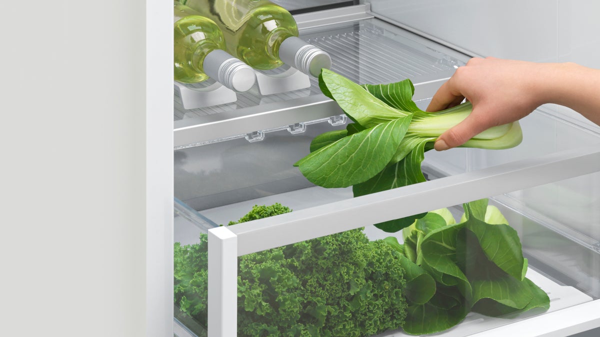 fisher-paykel-integrated-refrigerator-freezer-ice-water-drawer-2 Fisher & Paykel integrated refrigerator freezer with panel-ready design, internal water dispenser, automatic ice maker, and flexible food storage.