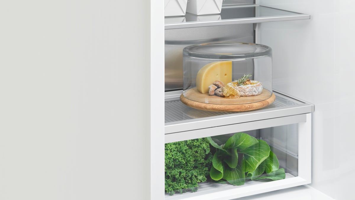 fisher-paykel-integrated-refrigerator-freezer-ice-water-drawer Fisher & Paykel integrated refrigerator freezer with panel-ready design, internal water dispenser, automatic ice maker, and flexible food storage.