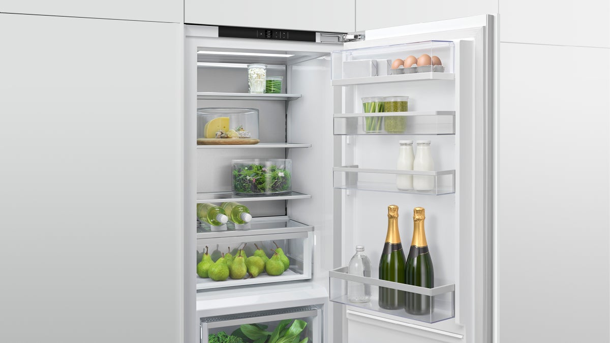 fisher-paykel-integrated-triple-zone-refrigerator-contents Fisher & Paykel integrated triple zone refrigerator with panel-ready design, internal water dispenser, and flexible food storage for modern kitchens.
