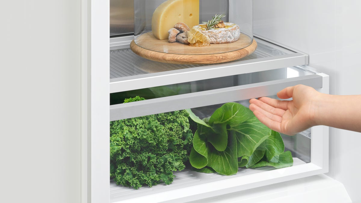 fisher-paykel-integrated-triple-zone-refrigerator-drawers Fisher & Paykel integrated triple zone refrigerator with panel-ready design, internal water dispenser, and flexible food storage for modern kitchens.