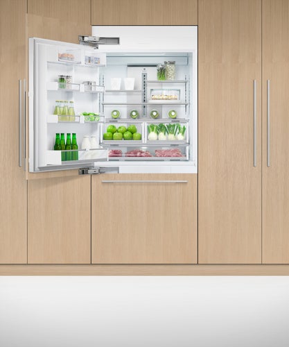 fisher-paykel-left-91cm-integrated-refrigerator-freezer-with-ice-unit-open Fisher & Paykel 91cm integrated refrigerator freezer with automatic ice maker, panel-ready design, and bottom freezer drawer for modern kitchens.