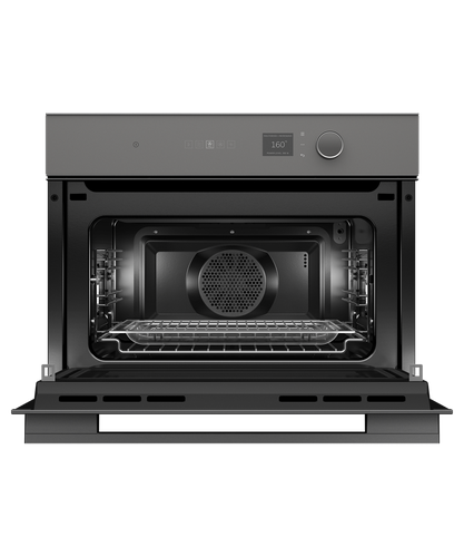 fisher-paykel-minimal-compact-combi-microwave-oven-grey-open Fisher & Paykel Minimal grey compact combi microwave oven with 19 cooking functions, Wi-Fi connectivity, and touchscreen controls.