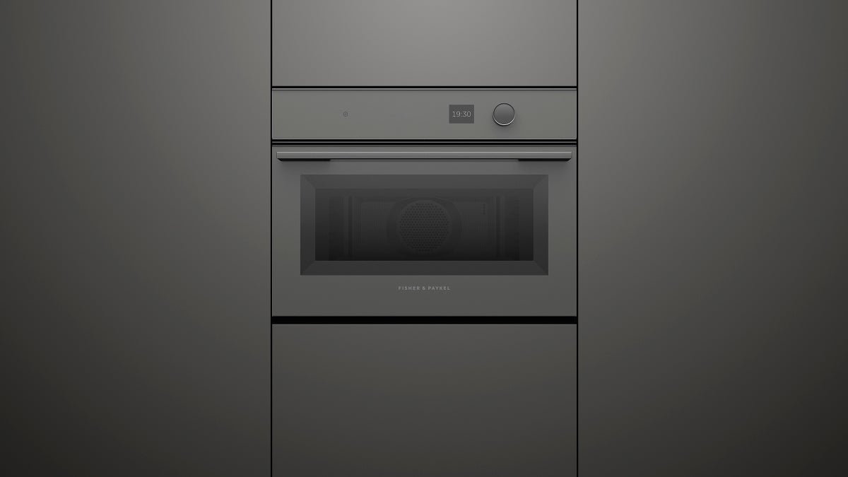fisher-paykel-minimal-compact-combi-microwave-oven-grey-unit Fisher & Paykel Minimal grey compact combi microwave oven with 19 cooking functions, Wi-Fi connectivity, and touchscreen controls.
