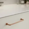 lounge-handle-brushed-copper-128mm-160mm-lifestyle Lounge brushed copper Zamac cabinet handle with ergonomic concave grip for kitchen cabinets and bespoke furniture.