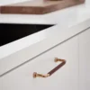 lounge-handle-dark-brown-polished-brass-160mm-lifestyle Lounge dark brown and polished brass Zamac cabinet handle with ergonomic concave grip for kitchen cabinets and bespoke furniture