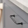 Lounge matt black Zamac cabinet handle with ergonomic concave grip for kitchen cabinets and bespoke furniture.