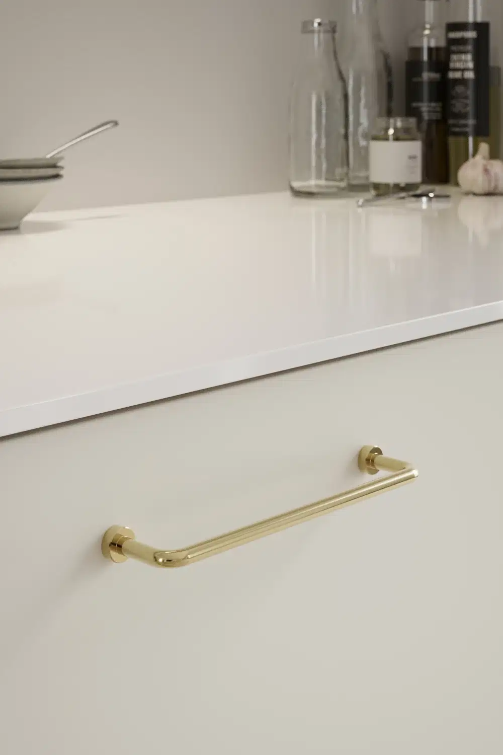 Lounge polished brass Zamac cabinet handle with ergonomic concave grip for kitchen cabinets and bespoke furniture.