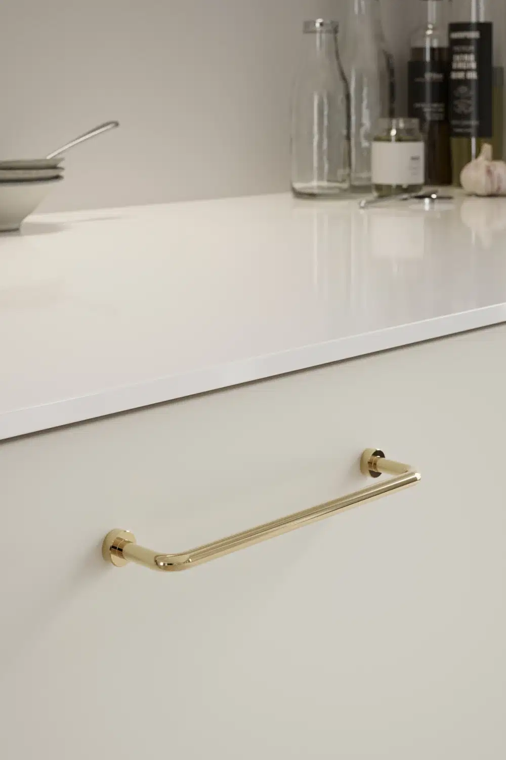 Lounge untreated polished brass Zamac cabinet handle with ergonomic concave grip for kitchen cabinets and bespoke furniture.