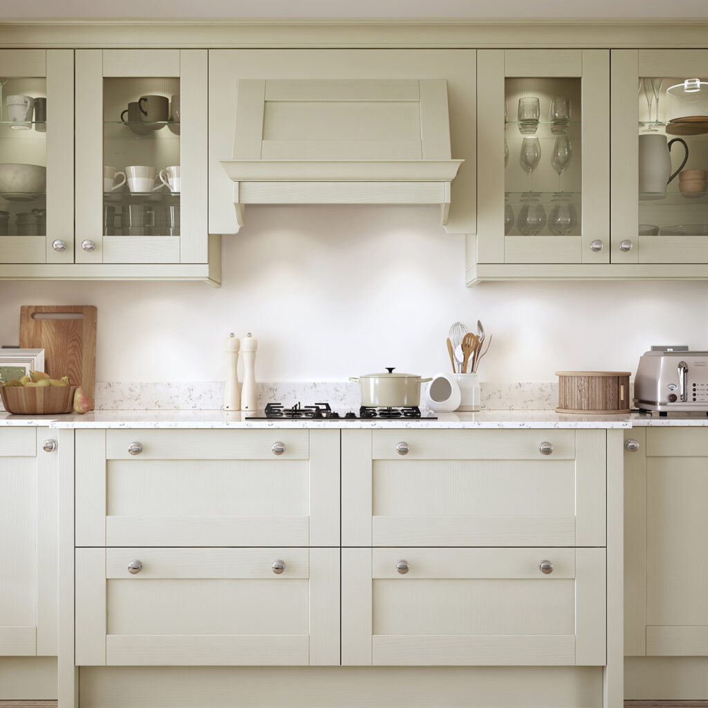 Close-up of a mussel shaker kitchen with glazed display cabinets and a traditional overmantle shelf.