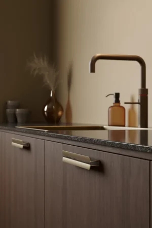 Papillon aluminium cabinet handle in dark brown with matt brass detail for kitchen cabinets, drawers, and bespoke furniture.