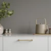 Segment cabinet handle with Inox-look aluminium and clear lacquered oak for kitchen cabinets, drawers, and bespoke furniture.