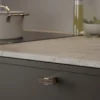 segment-knob-dark-brown-brushed-brass Segment cabinet knob in dark brown with brushed brass detail for kitchen cabinets, drawers, and bespoke furniture