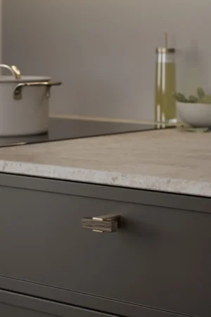 Segment cabinet knob in dark brown with brushed brass detail for kitchen cabinets, drawers, and bespoke furniture
