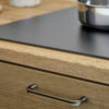 Terra matt bronze cast iron cabinet handle for kitchen cabinets, drawers, wardrobes, and bespoke furniture.