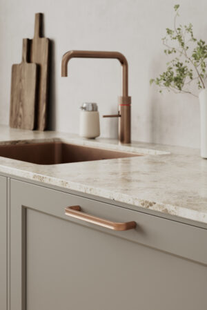 Terra brushed copper cast iron cabinet handle for kitchen cabinets, drawers, wardrobes, and bespoke furniture.