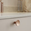 Terra_559820037-96 Terra brushed copper cast iron cabinet knob for kitchen cabinets, drawers, wardrobes, and bespoke furniture.